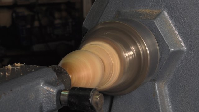 wood turner cutting shapes in wood