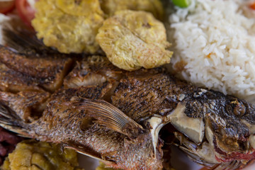 fried fish served with beans, rice and banana, typical from Nicaragua