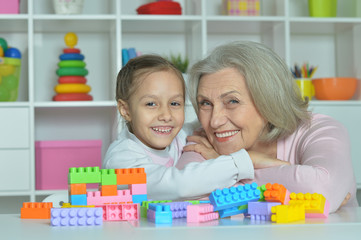 Grandmother with granddaughter playing together