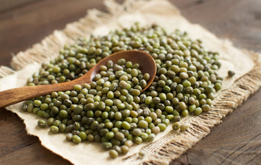 Uncooked Mung beans with a spoon