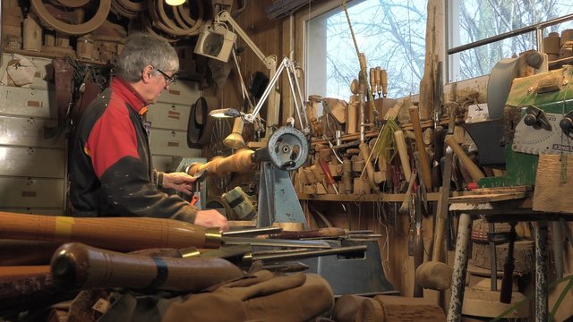 wood turner cutting shapes in wood