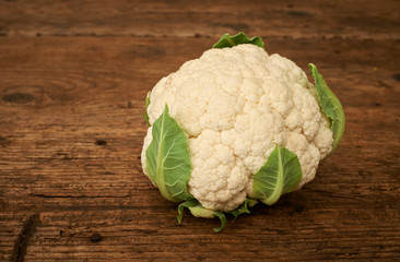 Fresh raw cauliflower on a kitchen bench.