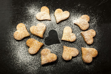 LOVE CONCEPT WITH HEART SHAPE COOKIES OVER SLATE