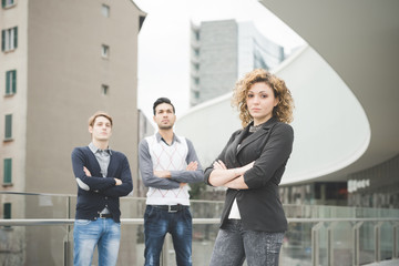 Fototapeta premium Knee figure of multiracial business people working posing outdoo