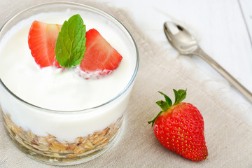 Yogurt with cereals and strawberries
