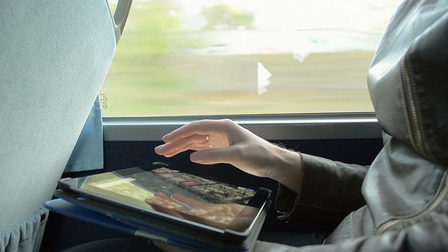 Close-Up of a Girl With the Tablet on the Bus