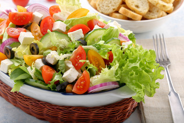Greek salad with feta cheese black olives and bruscheta