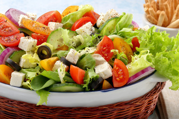 Greek salad with feta cheese black olives and grissini