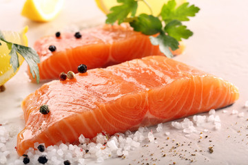 Fresh raw salmon on stone background