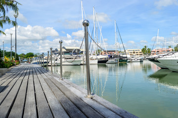 wooden walk way at boat lagoon marina Phuket in Thailand