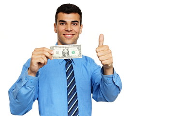 Smiling young businessman shows you bank-note one dollar and thumb up