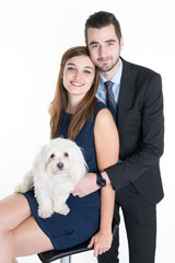 Couple cuddling dog loving family  isolated