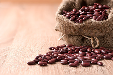 Kidney bean,Red beans in sack on wood table