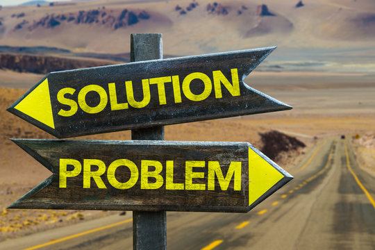 Solution - Problem signpost in a desert road on background