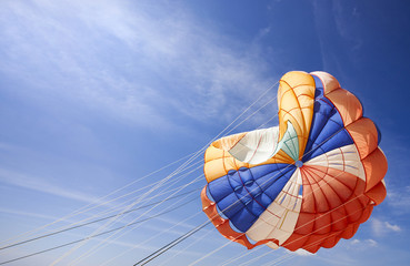 The dome of a parachute in the sky