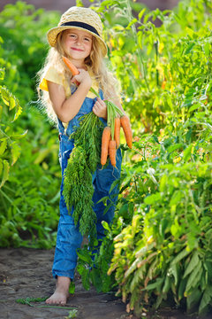 The farmer kid with vegetables