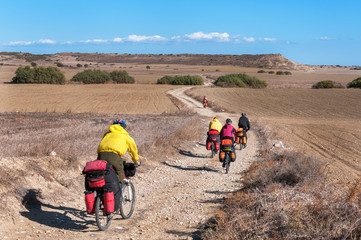 Cyclists riding on mountain serpentine