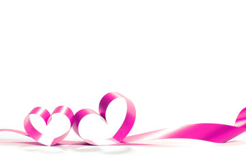 Ribbons shaped as hearts on white