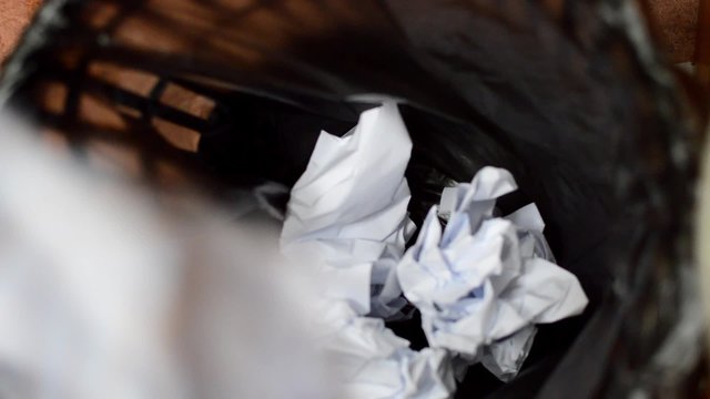 In the office, throw leaflets into the trash