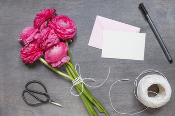 Some peonies with card, envelope and vintage scissors
