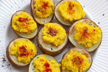 hummus served with baked potatoes
