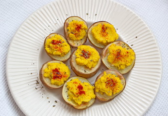 curry hummus served with baked potatoes