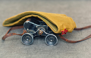 Old military binoculars and field cap