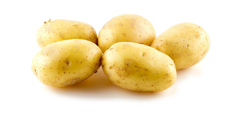 Group of bright yellow clean potatoes on white