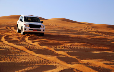 Off road vehicle on sand dunes, Oman