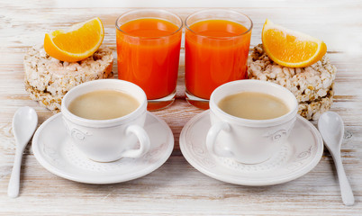 Healthy breakfast with two   coffee cup and orange juice