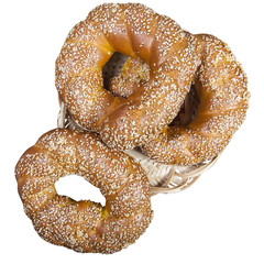 Buns with sesame seeds in a wicker plate