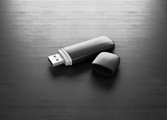 Open USB drive on a black wooden background. 3d.