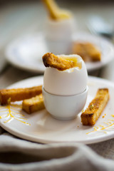Boiled egg and toast for breakfast close up