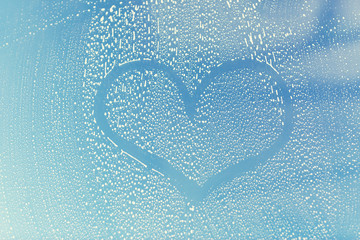 close up of heart shape on soapy window glass