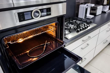 Foto op Plexiglas Modern hi-tek kitchen, oven with door open © starush
