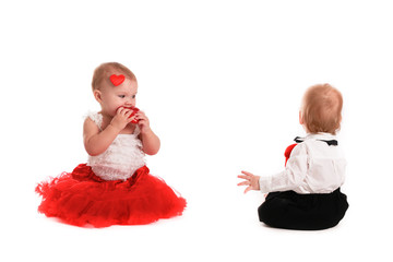 couple girl and boy babies playing with hearts concept valentine