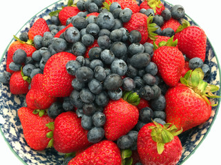 Strawberries and Blueberries in a Bowl on a Wooden Table
