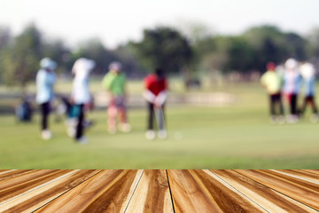 perspective wood and blurred golfers hit sweeping and keep golf