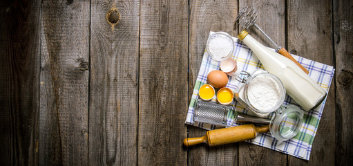 Preparation of the dough. Ingredients for the dough - Milk, eggs, flour on the cloth.