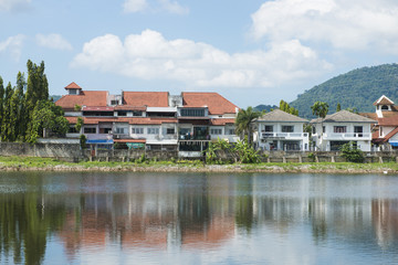 houses along the waterfront with a reflection