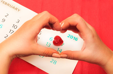 date of February 14 on the calendar, Valentine's Day red heart encircled