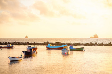 Fishing boats on the sunrise