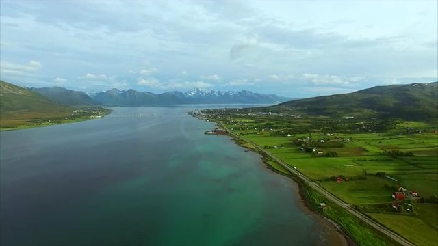 Scenic aerial footage of countryside near town of Sortland with its long spanning bridge on Vesteralen islands in Norway. Aerial 4k Ultra HD.