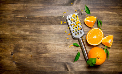 Fresh oranges with grater and zest .  Free space for text .