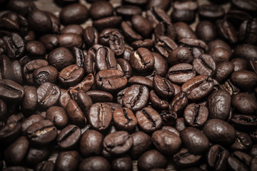 Coffee beans texture for background. Selective focus. Toned