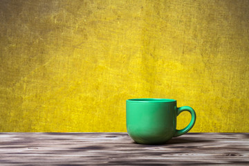 Cup of tea on new wooden board and burlap background