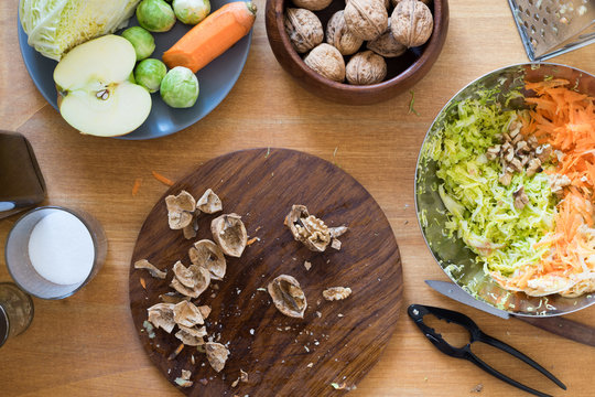 Cracked walnuts for cabbage, carrot and apple salad