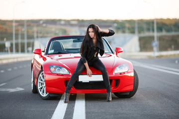 girl near red car