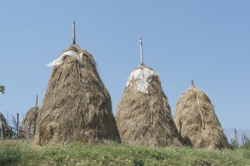 3 haystacks on hill