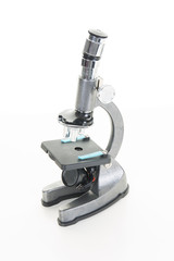 Photo of a professional ocular laboratory microscope with stereo eyepiece isolated on a white background. This is a genuine piece of equipment and the type that would be used in a real lab.